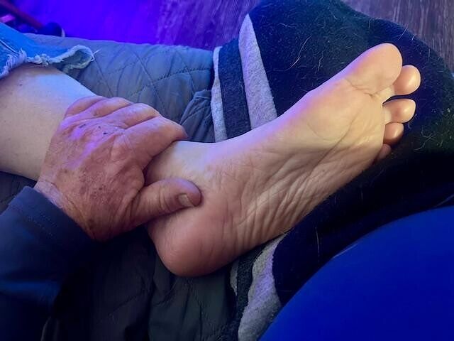 Rubbing her feet