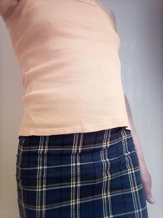 В спідничці