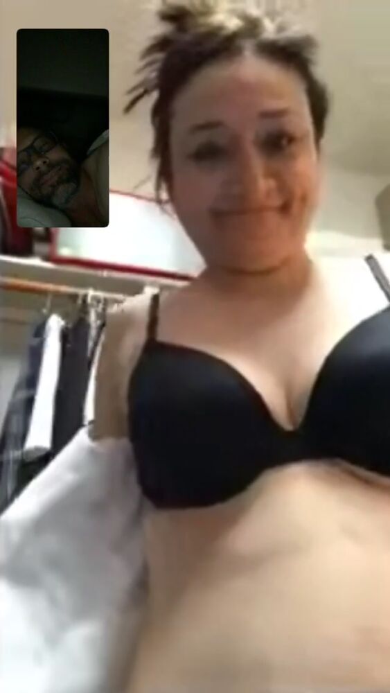 Sandra undresses and plays with her boobs